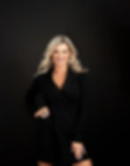 A woman wearing black suit for her headshot session with Visalia photographer Gigi Kraus