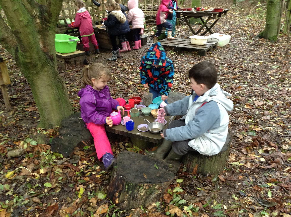 Making tea in the mud kitchen