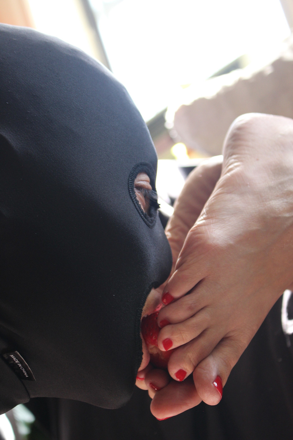Slave boy gets his dinner from Mistress's feet.