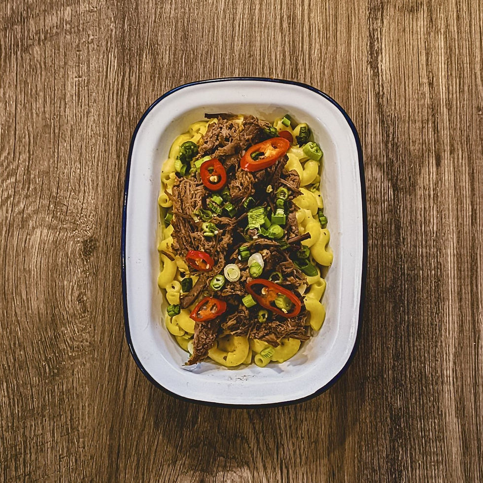 Shredded Beef Brisket Mac & Cheese in a white dish