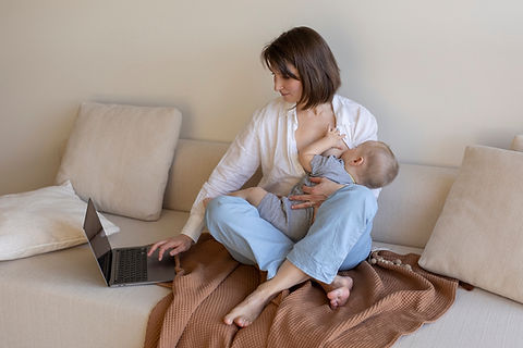 mother-breast-feeding-her-child-while-working_23-2149317211.jpg_w=2000&t=st=1695801954~exp