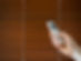 male hand holds a remote control to open