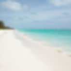 White sand beach with turquoise ocean water