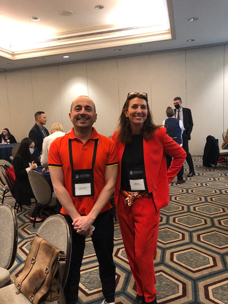 Jérôme and Nathalie getting ready to present in matching orange