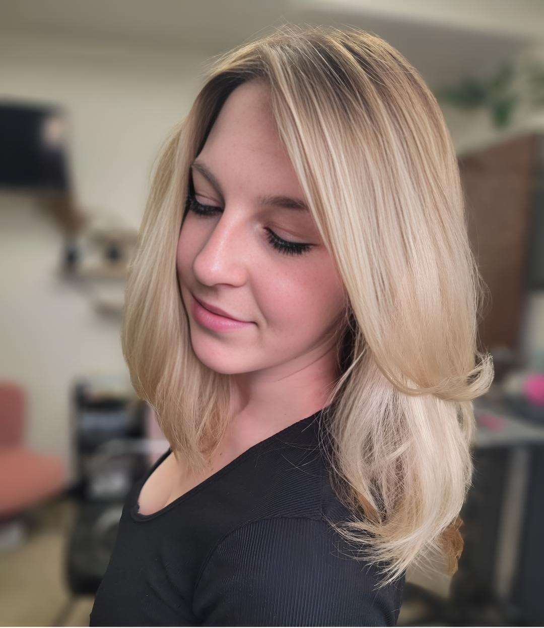 Client at Flaired Beauty with low-maintenance blonde hair