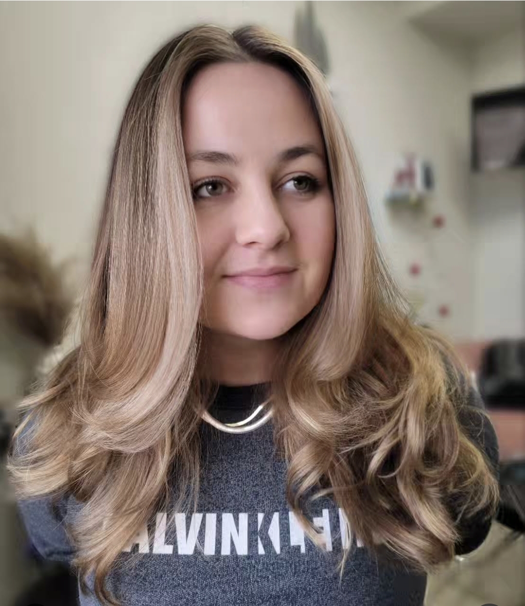 Client at Flaired Beauty with low-maintenance blonde hair