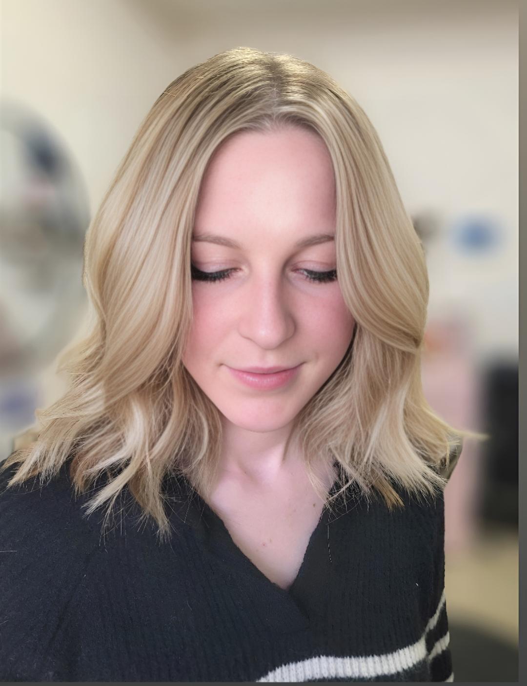 Client with fresh low-maintenance blonde highlights created at Flaired Beauty in El Paso, styled for an effortless, radiant finish.