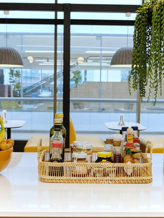 Kitchen counter with fruit, condiments, and snacks