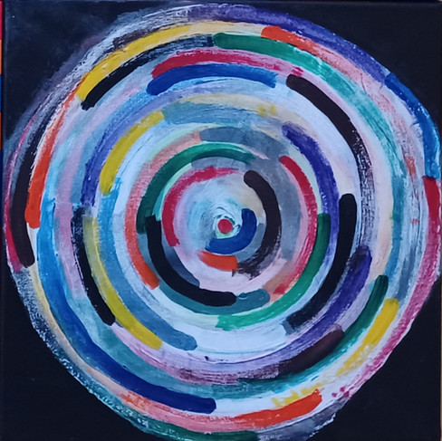 A circular swirl of colors against a black background