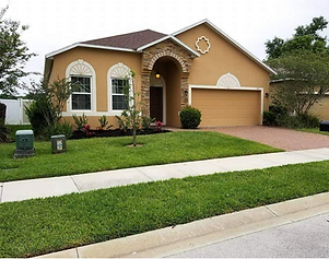 A picture of a house that bulldog lawn and landscaping services for a monthly lawn care client