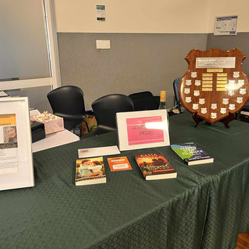 Award and books displayed on table