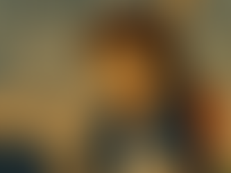 A smiling person in a suit at a desk holds an envelope labeled "John," in front of a laptop. Three people in the background show varied emotions.