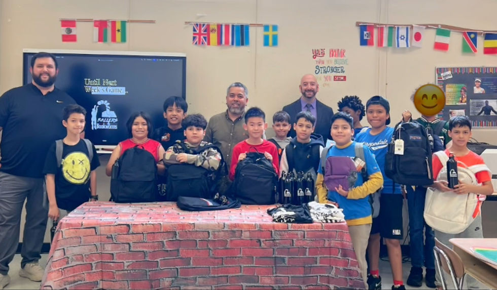 Close-up view of a filled backpack with colorful school supplies inside on a classroom desk