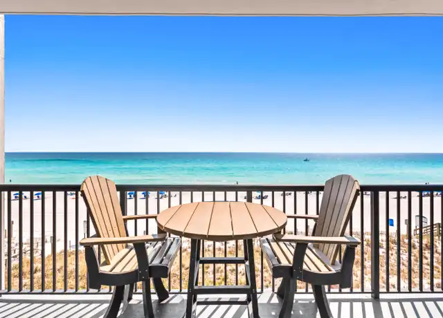 Chair and table on balcony of Condo view in Fort Walton Beach
