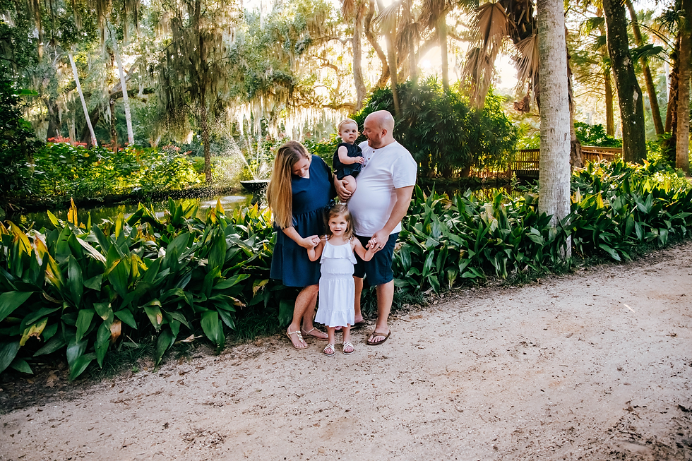 family portrait in beautiful garden at sunset