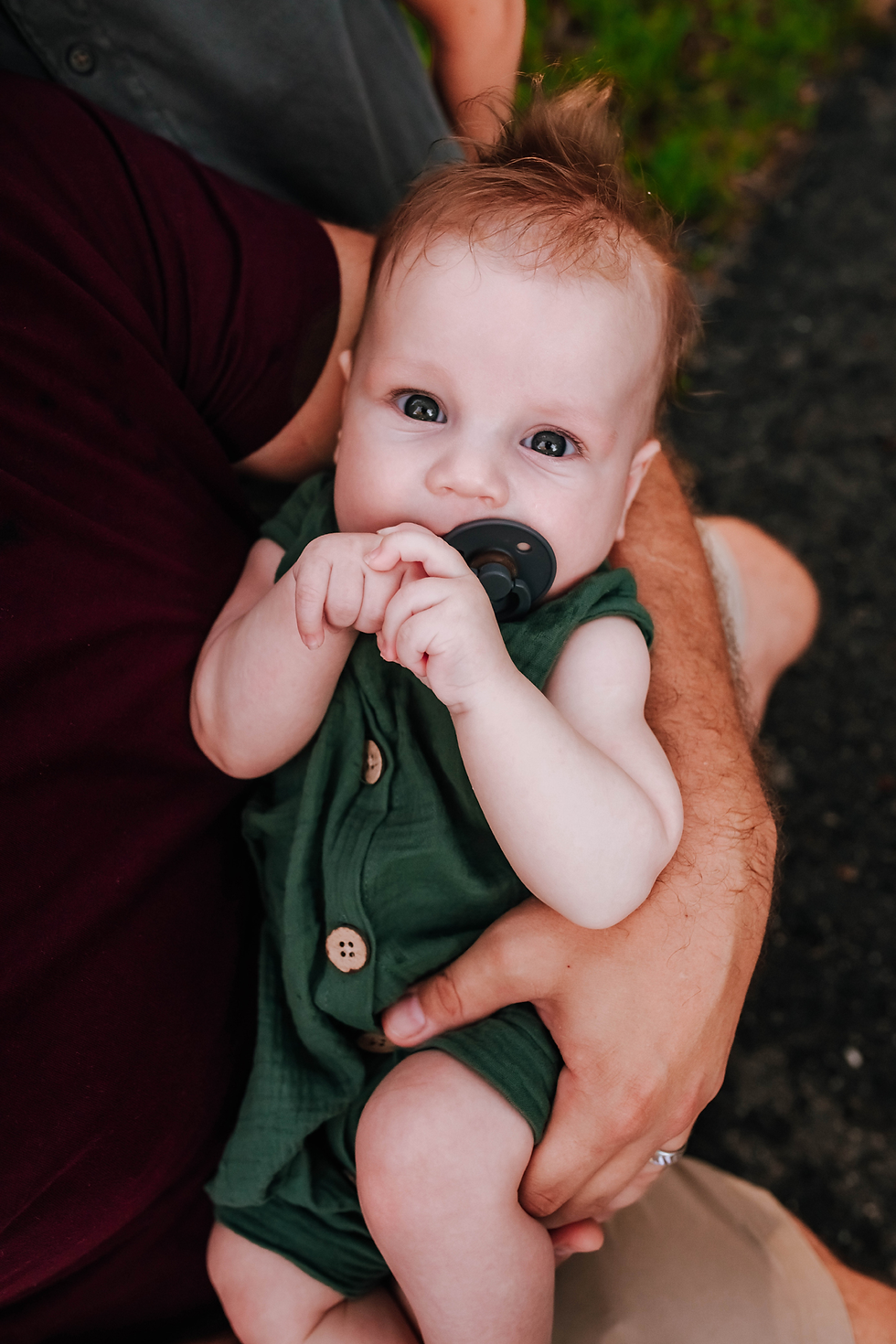 close up of 4 month old baby in family photo