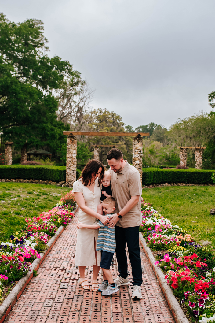 family hugging together during family photoshoot at florida state park
