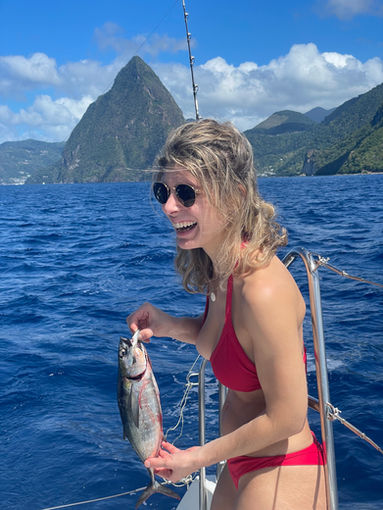 Kite Cruise girl caught a little tuna in the Caribbean in front of the famous Pitons of Saint Lucia