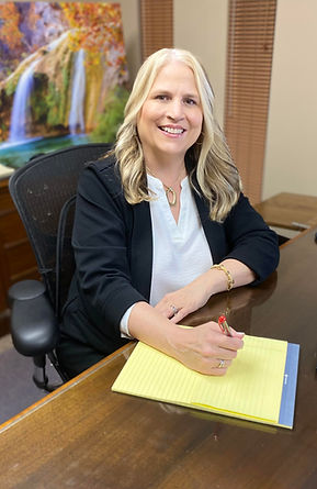 Pam Howlett at her desk