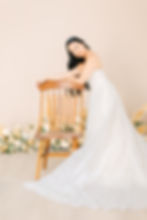 A bride posing on a chair in a Fort Worth studio