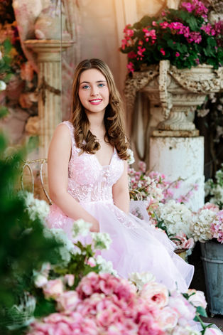 Dallas family photographer highlights a confident and joyful teen during her Sweet Sixteen portraits with soft curls and natural light
