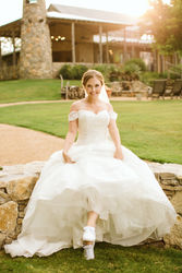 Photoshoot in a wedding dress at the Brooks at Weatherford, Swan Photography, romantic bridal portraits, overcast lighting for wedding photography, off the shoulder wedding dress, timeless wedding photography
