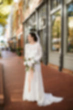 Modest bride posing for her portrait in Downtown Fort Worth, best wedding photographer in Fort Worth