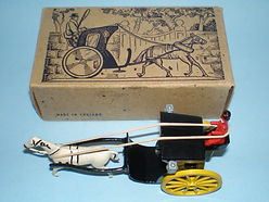 A scale model of an early Victorian Hanson cab, in black and yellow A scale model of an early Victorian Hanson cab, in black and yellow