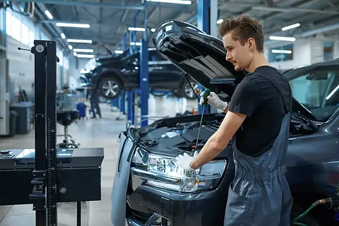 male-mechanic-adjusts-the-headlights-car-service-2026-01-06-09-21-59-utc.webp