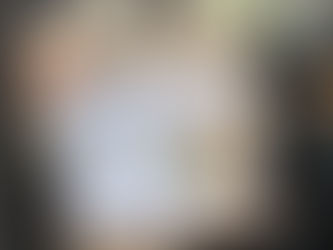 man holding a "Nourish Now" box. 