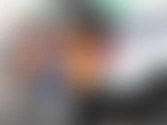 Food bank volunteers loading donated food into recipients' cars.