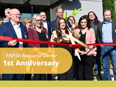 Group of FARSB staff doing a ribbon cutting.