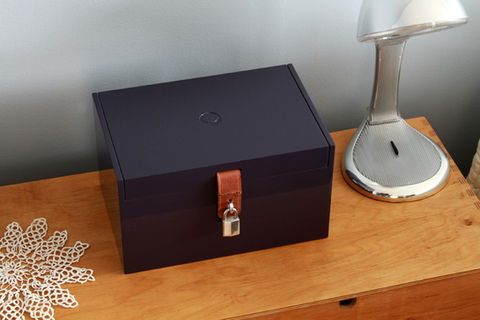 Product shot of lockbox shot in location on a dresser in a bedroom with natural light