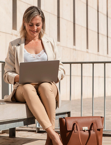 full-shot-woman-working-laptop.jpg