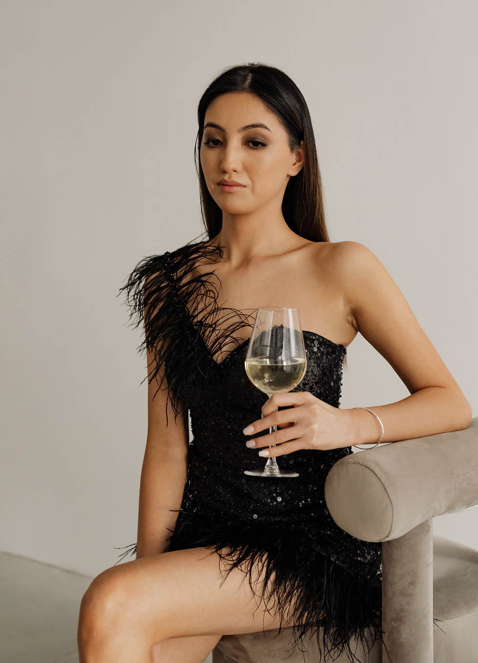 kaboompics_classy-aesthetics-beautiful-asian-woman-in-black-evening-dress-white-wine-in-a-