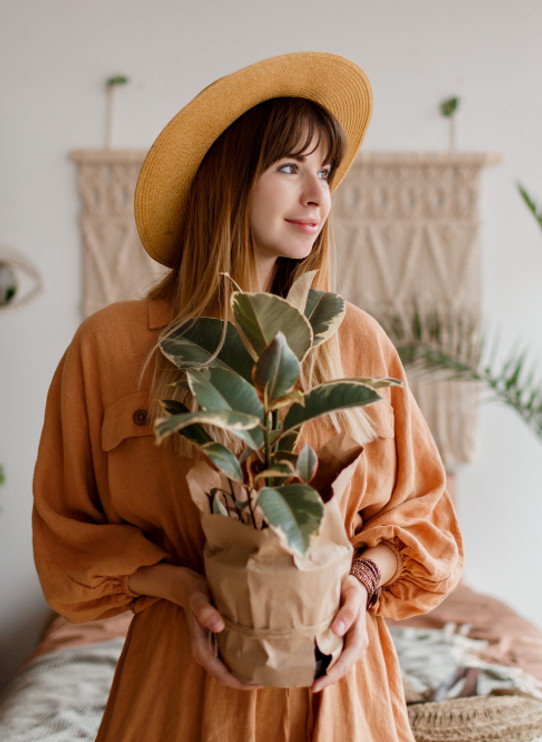 lovely-woman-linen-dress-straw-hat-posing-boho-style-apartment.jpg