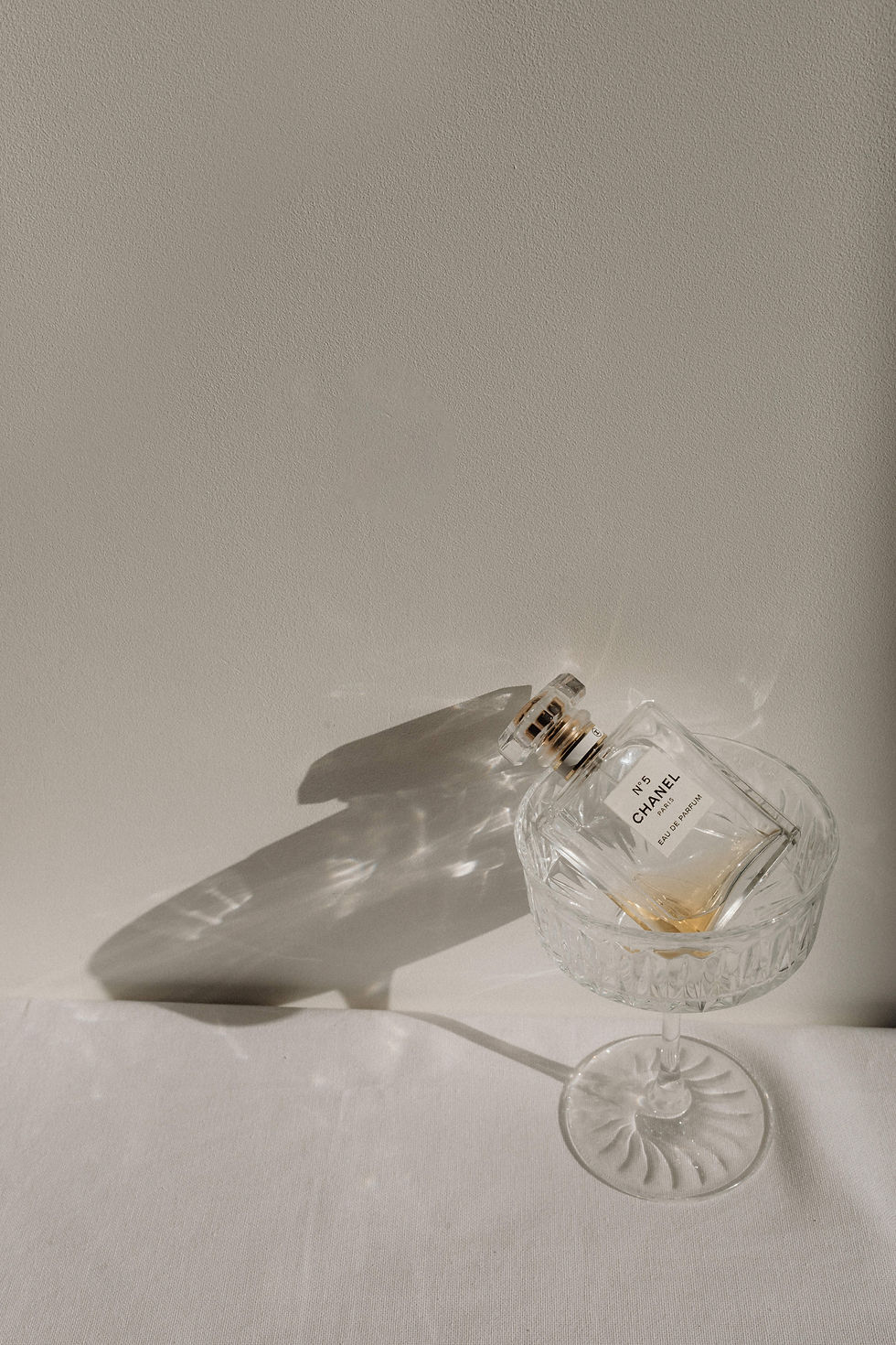kaboompics_refined-aromas-perfume-bottles-cast-in-shadows-and-light-35448.jpg