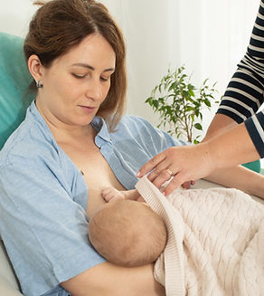 Breastfeeding consultant supports young mother to overcome problems.jpg