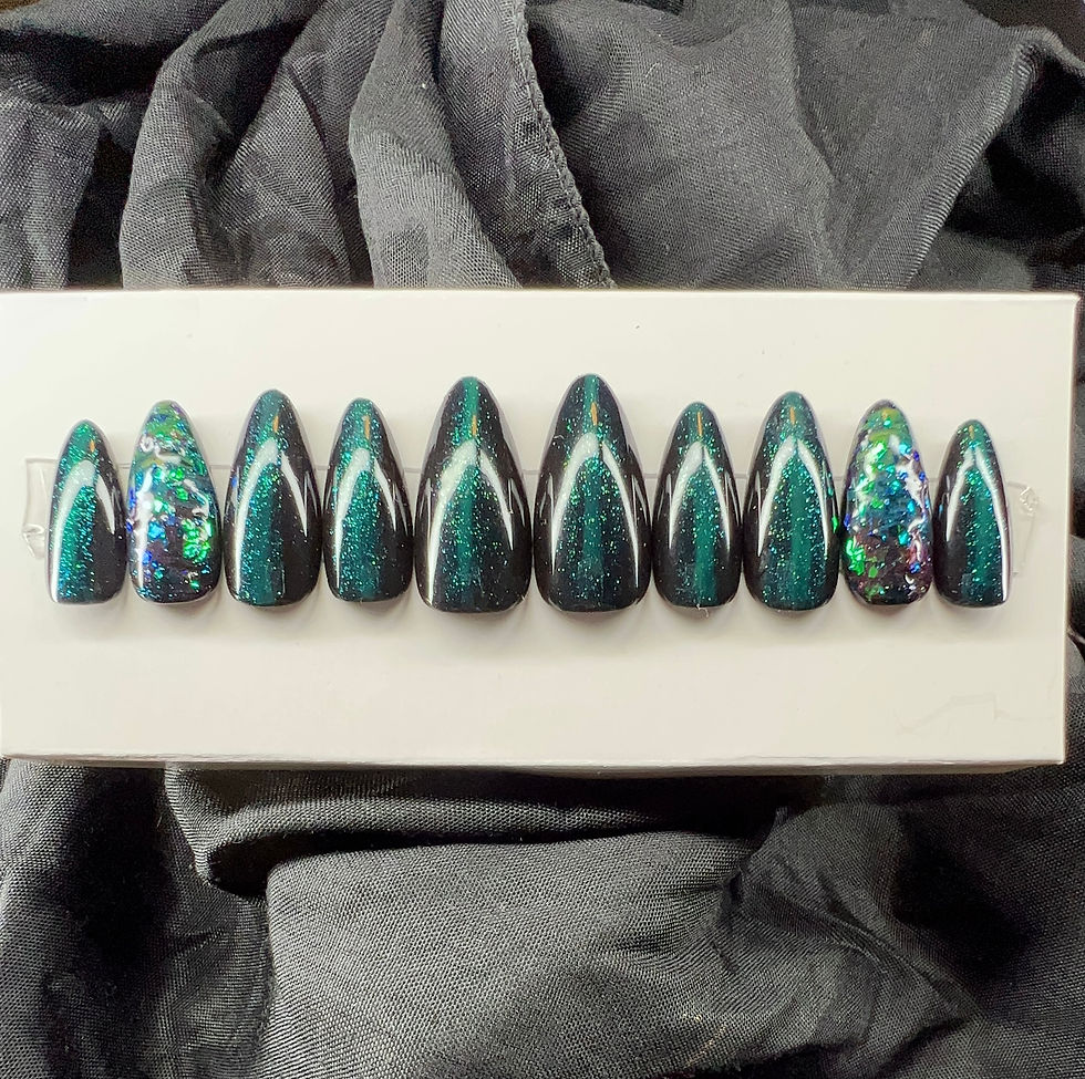 Almond shaped; forest green colored press-on nails.