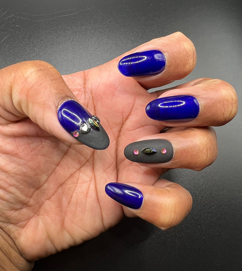 short oval press-on nails in blue and black on a hand