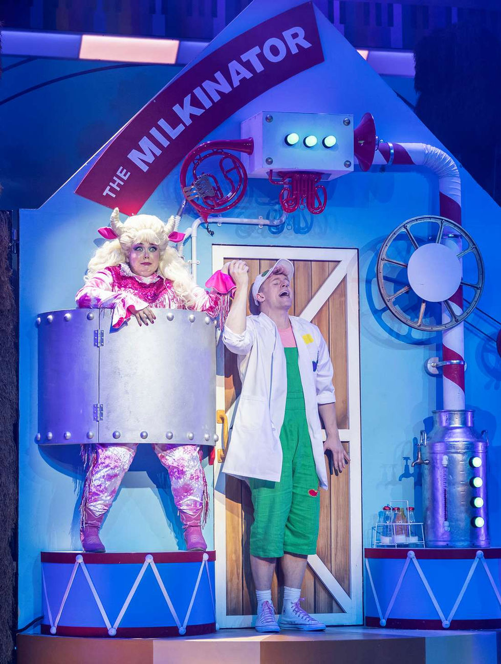 A production photo of Dolly the cow in the milkinator machine