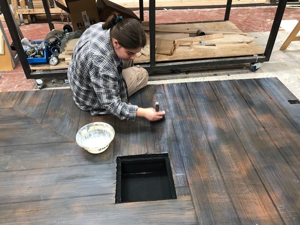 A photo of me woodgraining a truck base