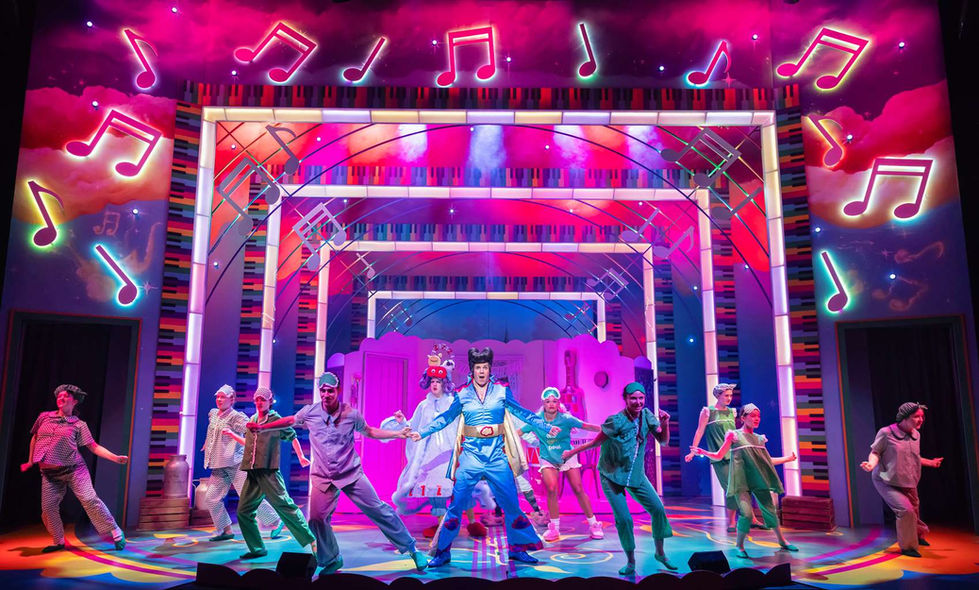 A production photo of the full company singing