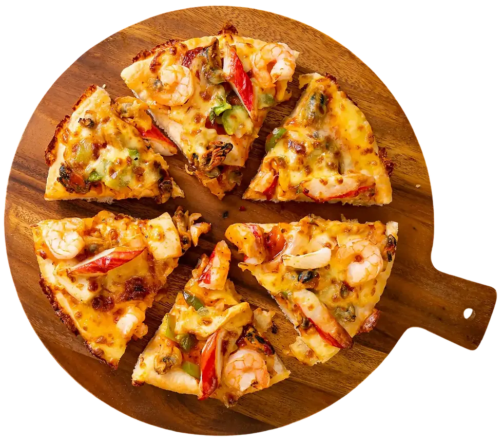 Seafood pizza slices with shrimp, crab, and vegetables on wooden board.