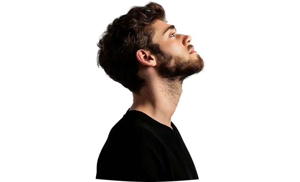 Profile of a young man with a beard looking upwards.