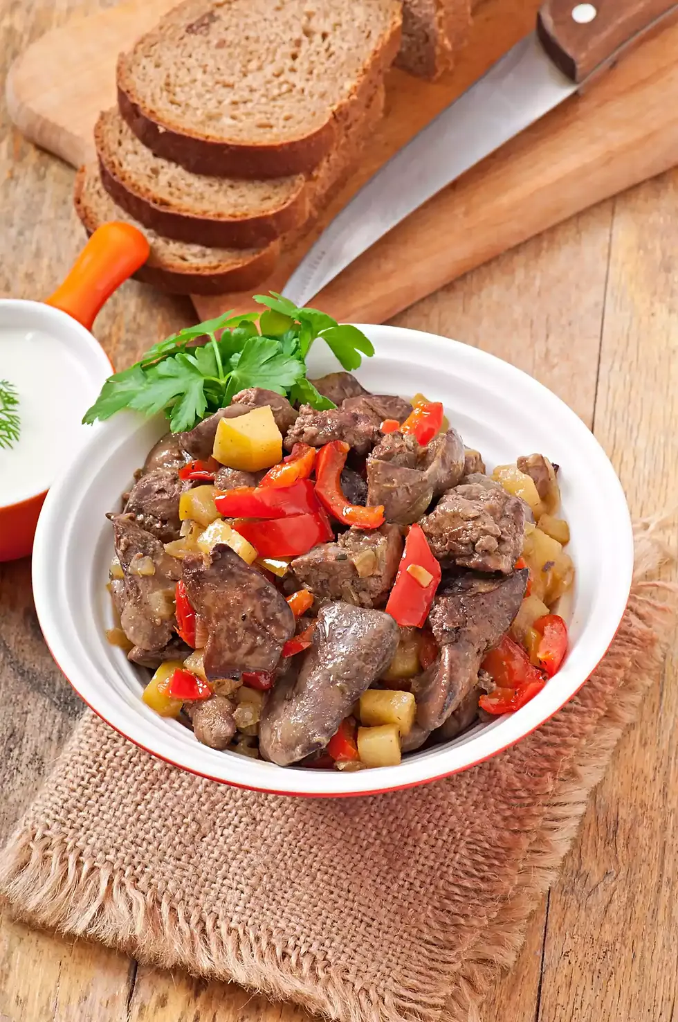 Delicious liver and vegetable dish with bread