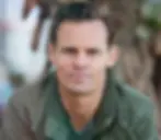 Man in green jacket, outdoors