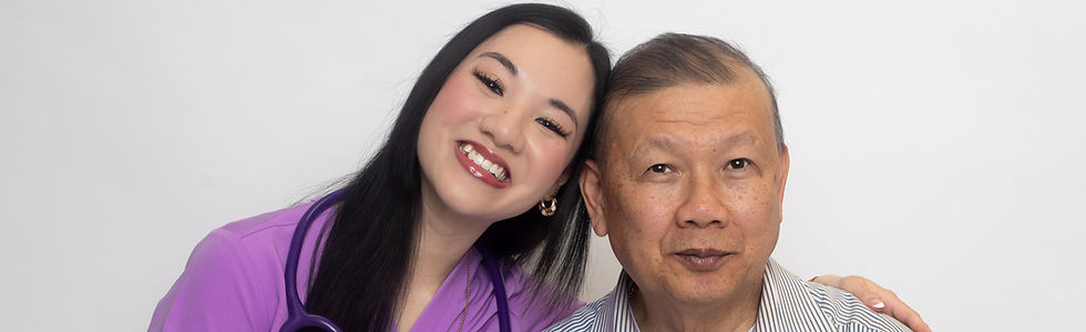 Chicago nurse and her father, portrait showing compassionate care, woman in purple scrubs with stethoscope smiling while standing next to senior man in striped shirt against a white studio background