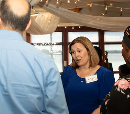 Joyful exchange during a Chicago social event, captured naturally by Walking Visions Photography Inc. to highlight connection and personality in every frame.
