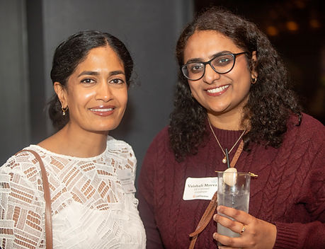 Two women smiling at the camera during an In-House Connect networking event at Marshall’s Landing in downtown Chicago, 222 W Merchandise Mart Plaza, Chicago, IL 60654.
